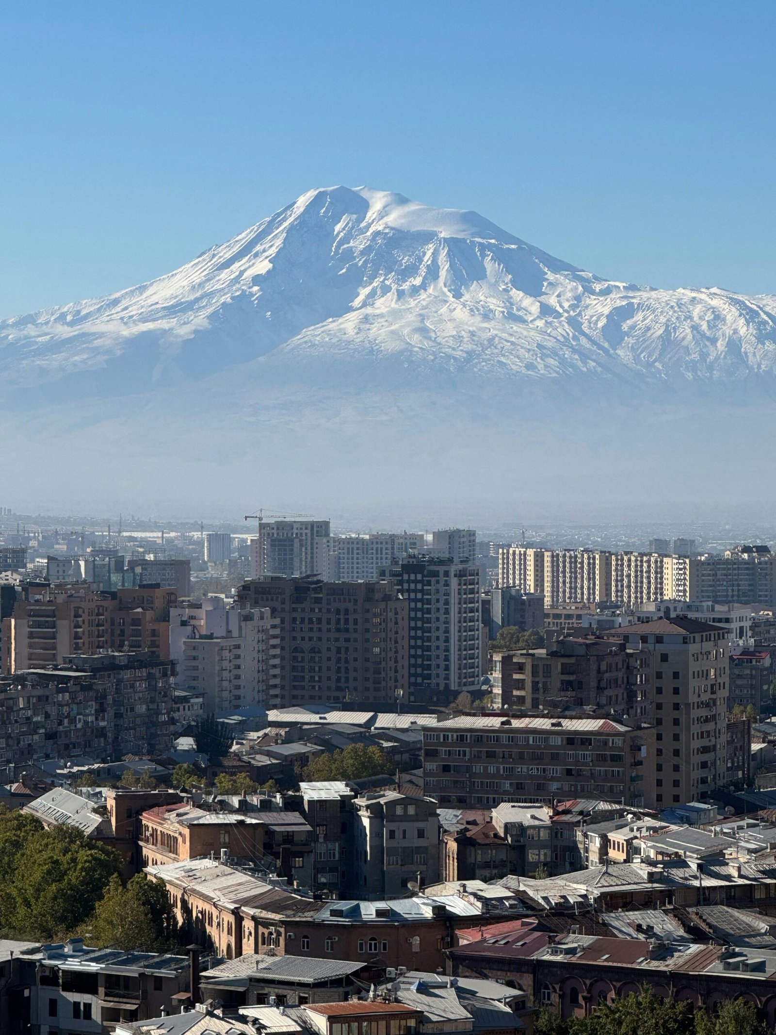 Scenic panorama of Yerevan city with Mount Ararat in the background, showcasing urban landscape under a clear sky.