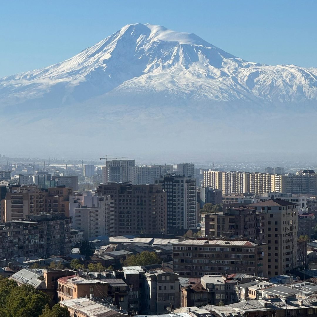 pexels-photo-30454809-30454809 Scenic panorama of Yerevan city with Mount Ararat in the background, showcasing urban landscape under a clear sky.